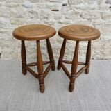 Pair of solid wood tripod stools, carved.