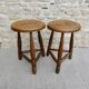 Pair of solid wood tripod stools, carved.