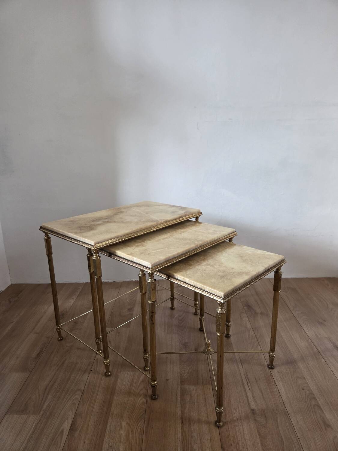 Nested tables in brass and marble, 1950.