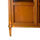 Straight molded clear wood cornice cabinet opening to two glass doors resting on  four sheath feet.