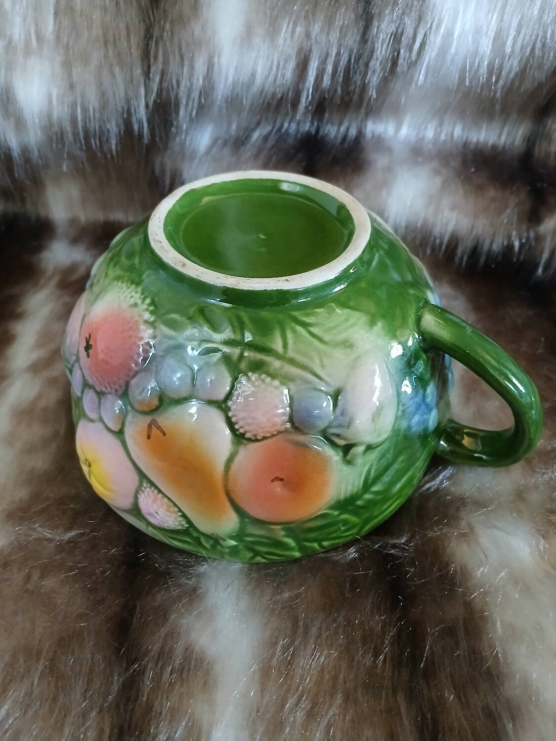 Antique cup and saucer in slipware.