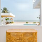 Curved chest of drawers with 4 rattan drawers