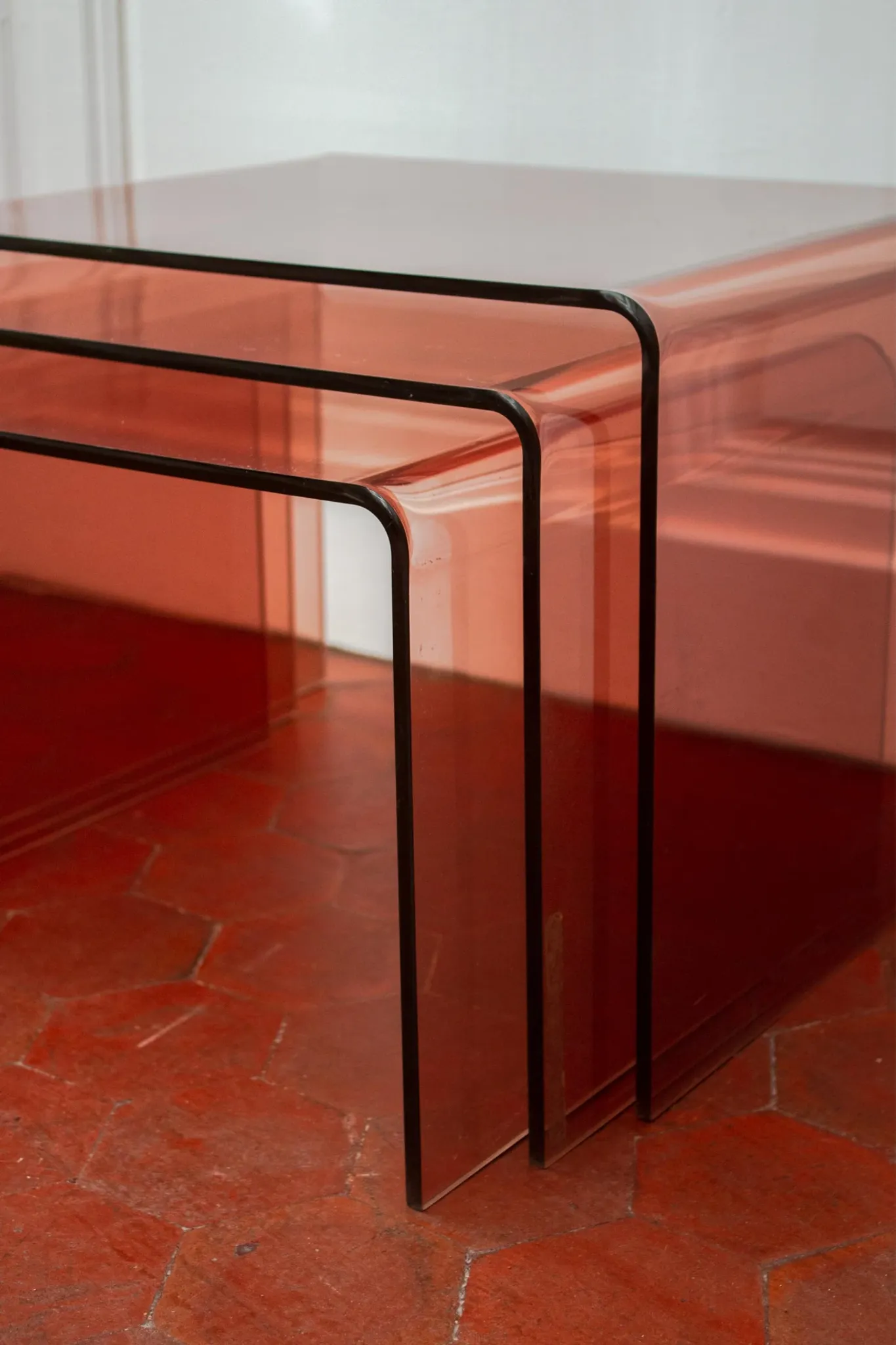 Vintage trio of nesting tables in smoked plexiglass by Michel Dumas, year