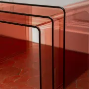 Vintage trio of nesting tables in smoked plexiglass by Michel Dumas, year