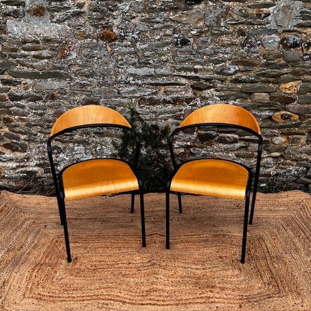 Pair of wooden and black metal chairs