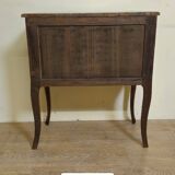 Louis XV style commode with a projection in marquetry.