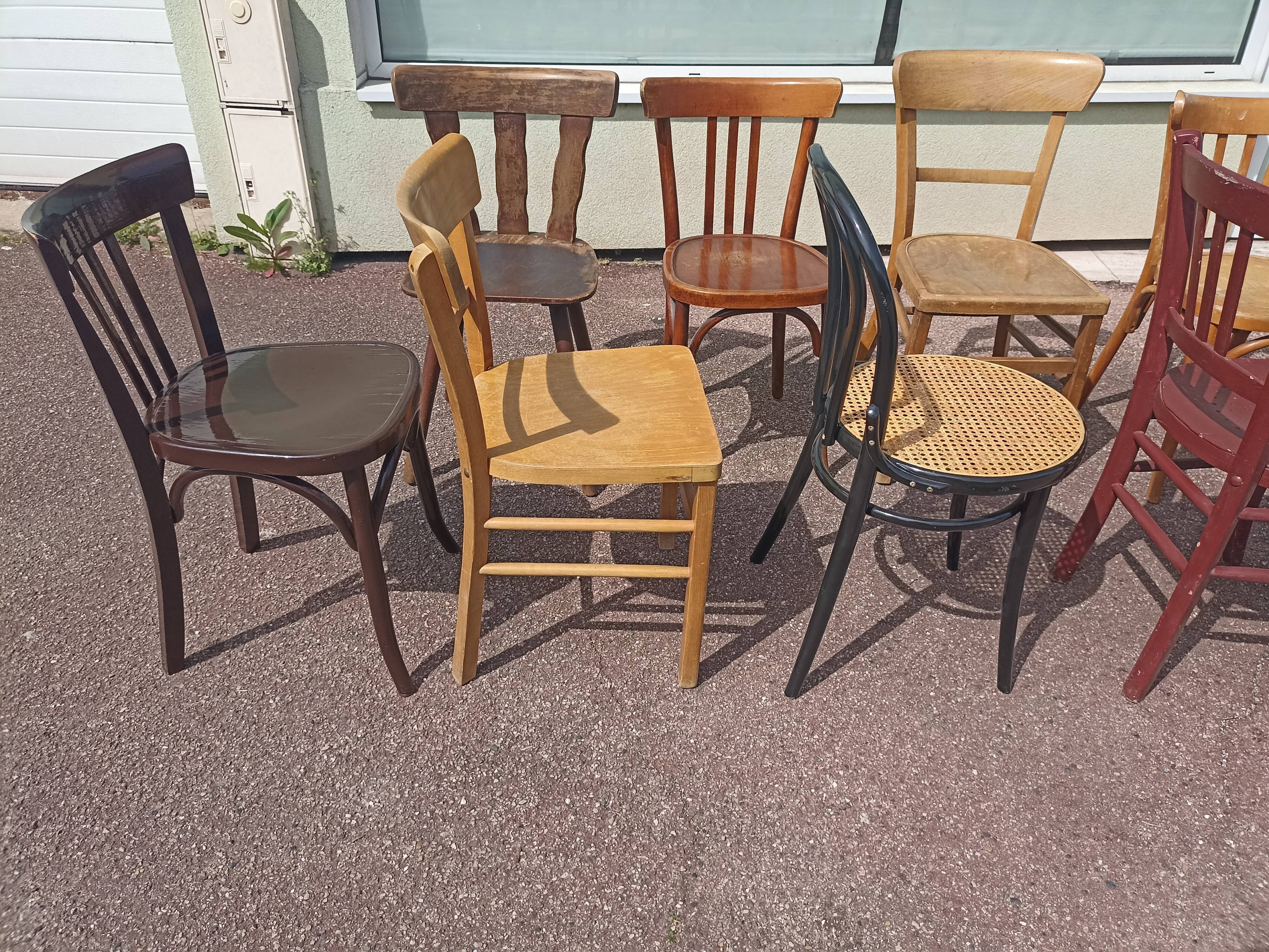Set of 12 mismatched wooden bistro chairs