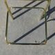 Nested table in gold metal and glass