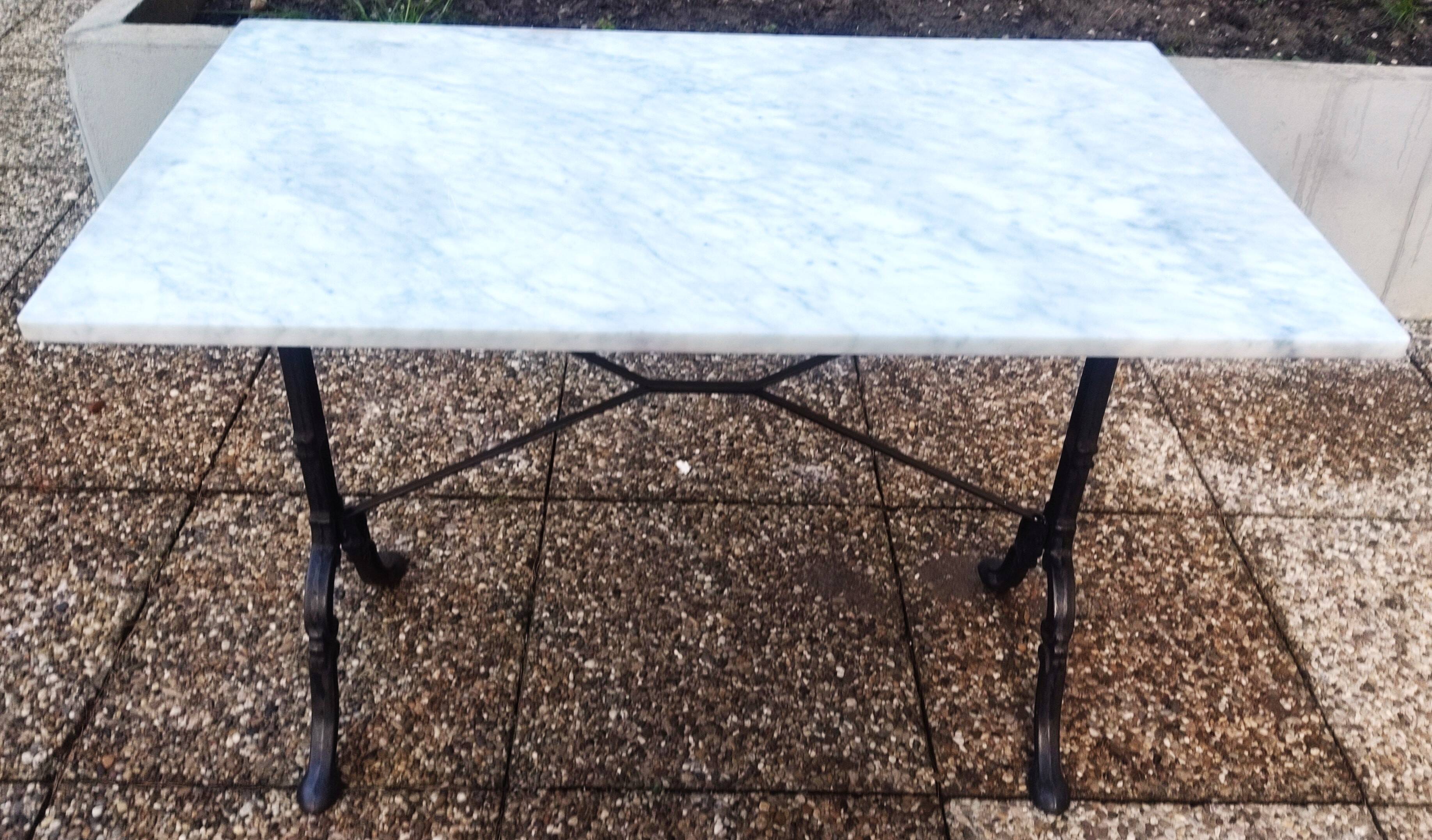 White marble table, cast iron base signed SNES, made in France