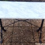 White marble table, cast iron base signed SNES, made in France
