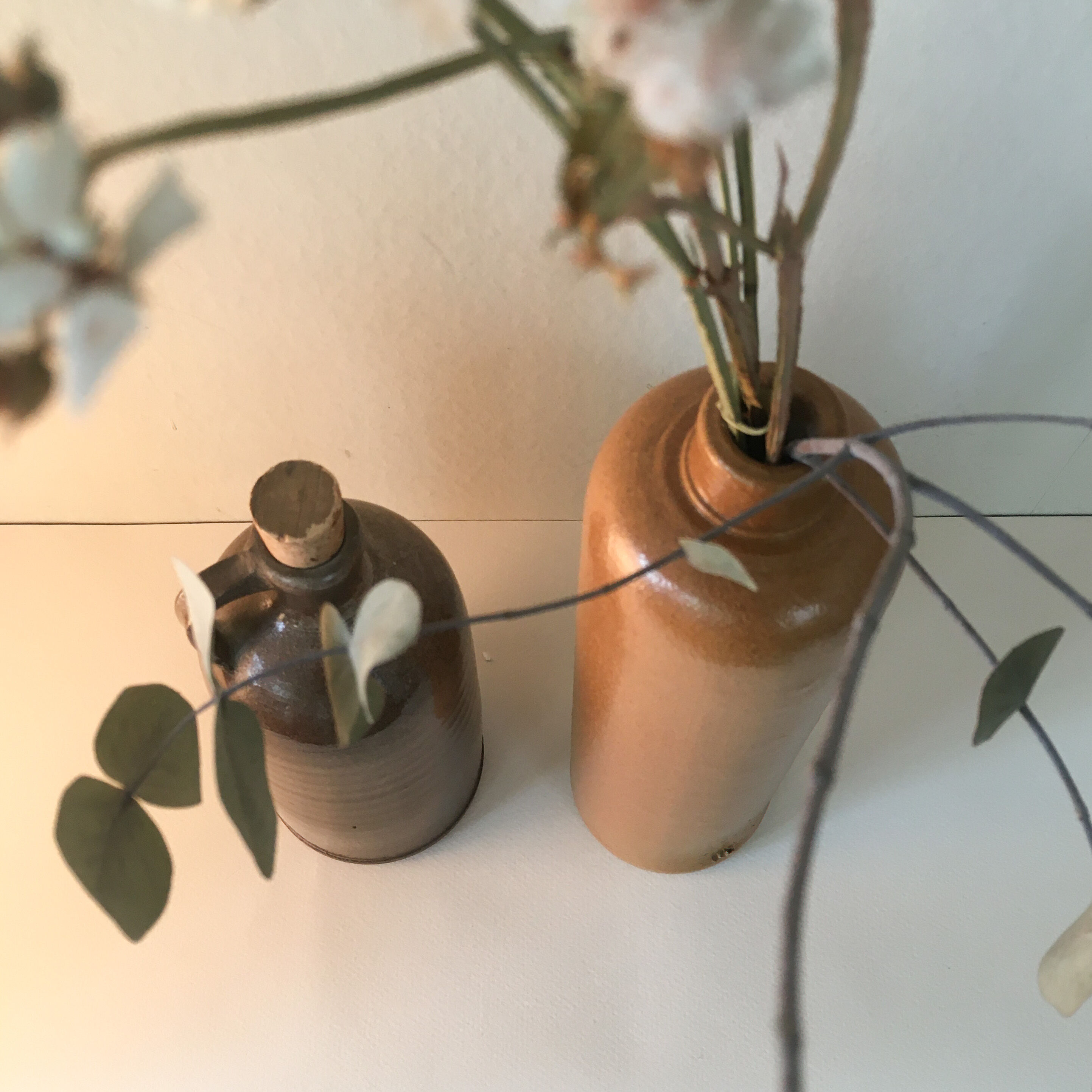 Duo of sandstone bottles