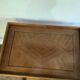 Nightstand in the shape of a lyre.