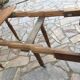 Table ronde 6 pieds 3 rallonges en noyer massif