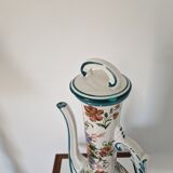 Old jug in flowered porcelain