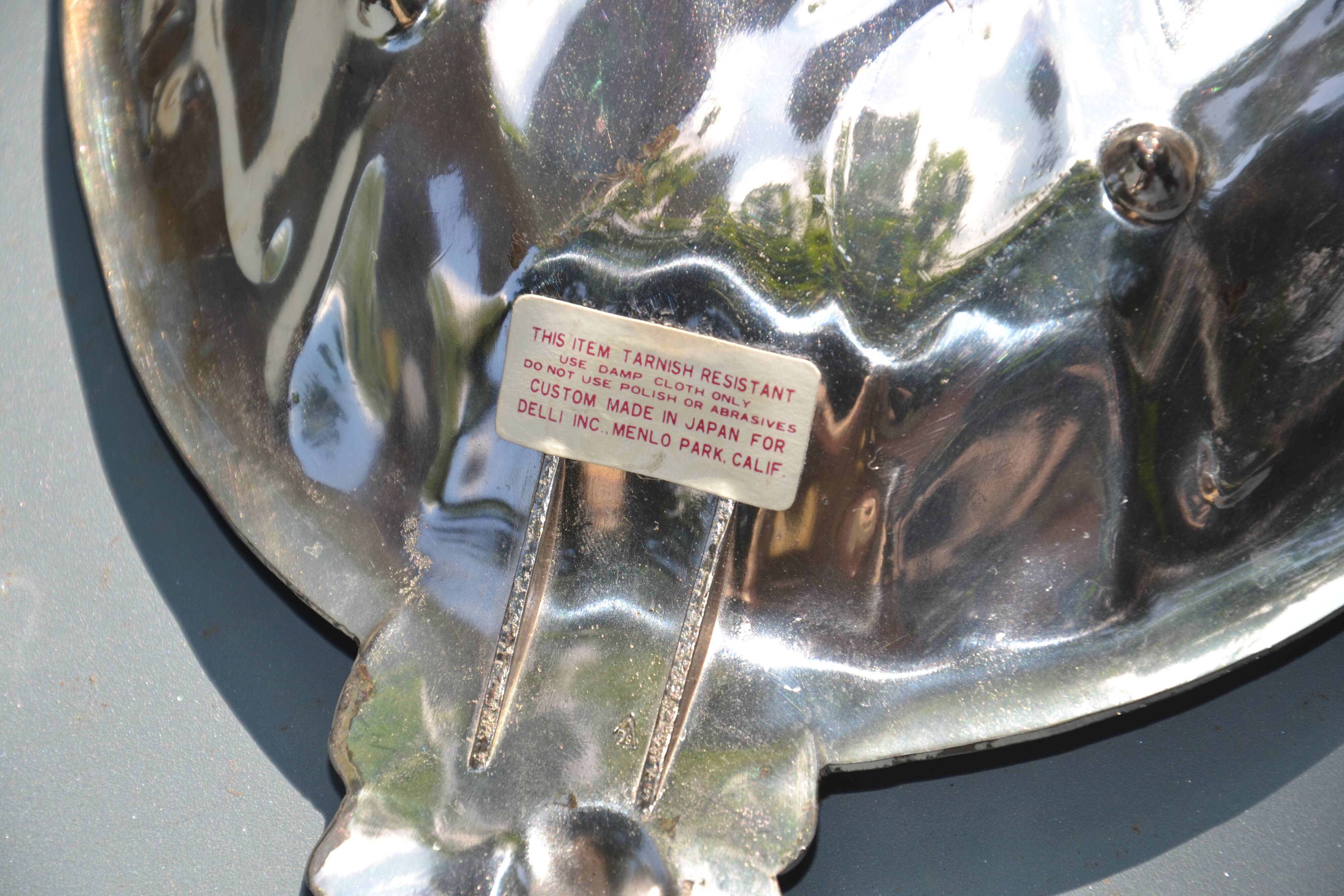 Silver-plated pineapple pocket emptier