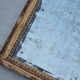 Antique mirror in a gilded wooden frame in the Louis XVI style, 19th century, 62x78 cm.