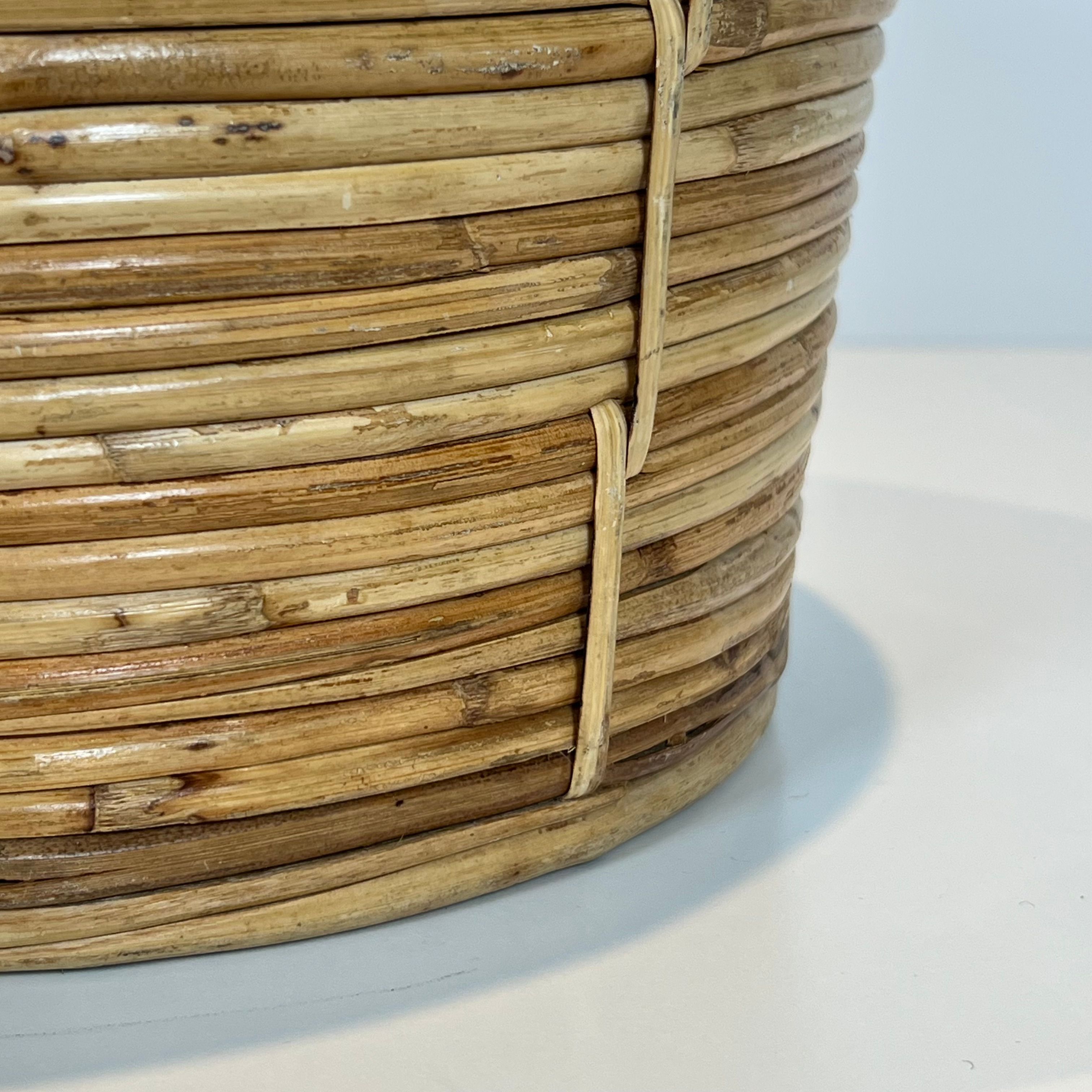 Rattan and brass wastepaper basket in the style of Gabriela Crespi.