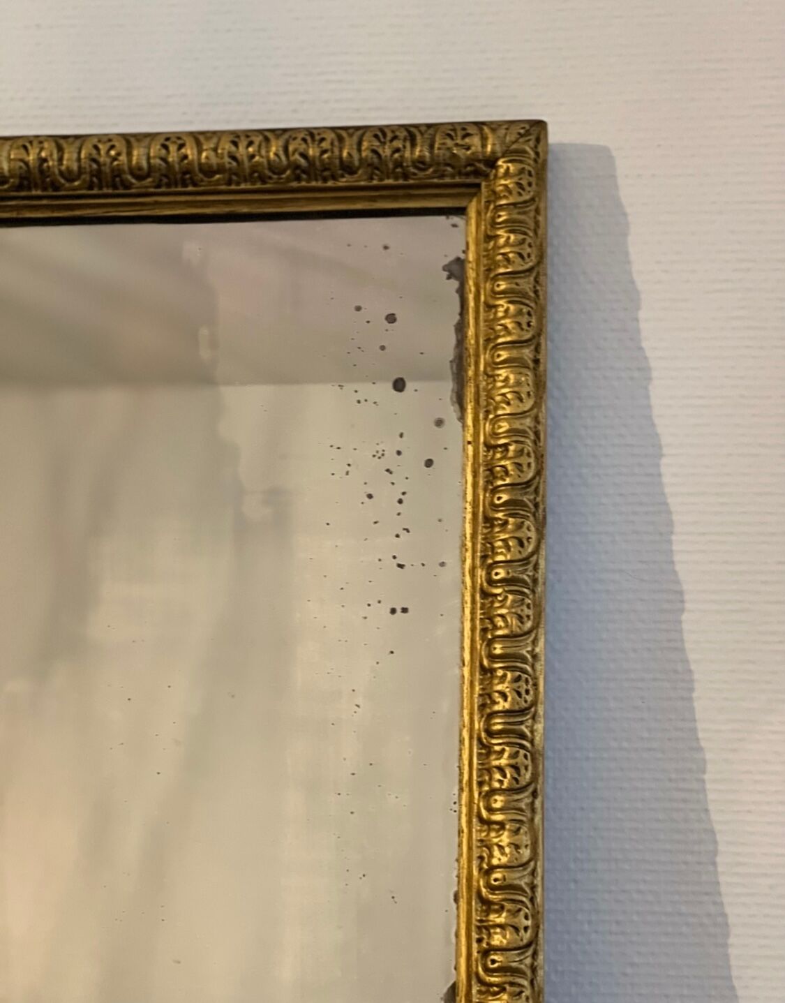 Old rectangular mirror between two golden Louis Philippe