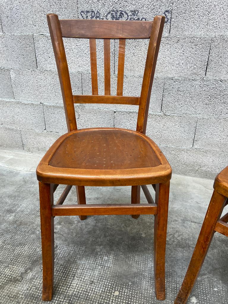 Two vintage curved wooden bistro chairs