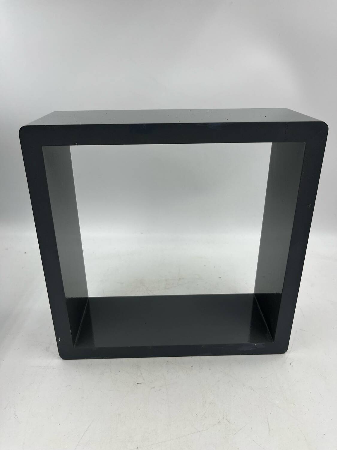 3 nesting shelves in grey lacquer.