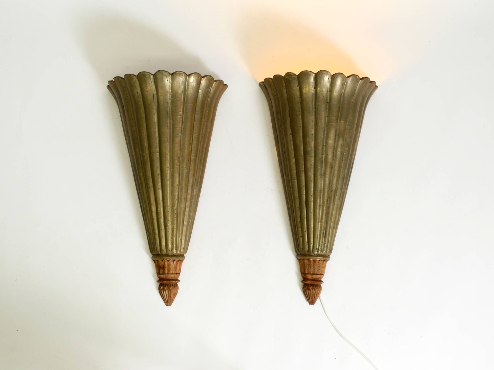Two large, rare 1950s wall lamps made of wood with aluminum cladding
