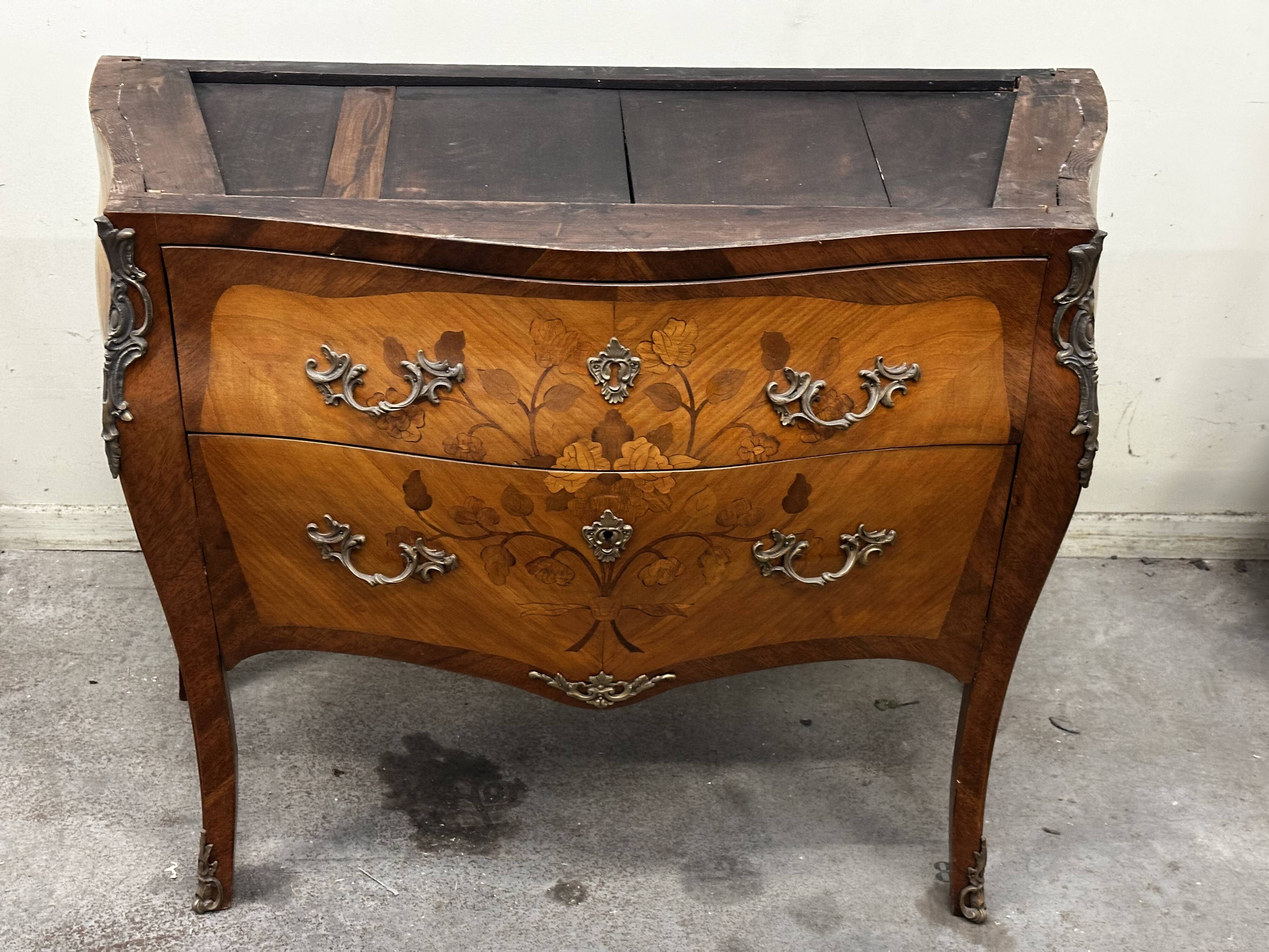 Curved and inlaid Louis XV style chest of drawers