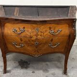Curved and inlaid Louis XV style chest of drawers