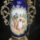 Pair of candlesticks. Bronze, brass, porcelain.