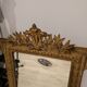 Antique mirror in Napoléon III style with a laurel pediment.