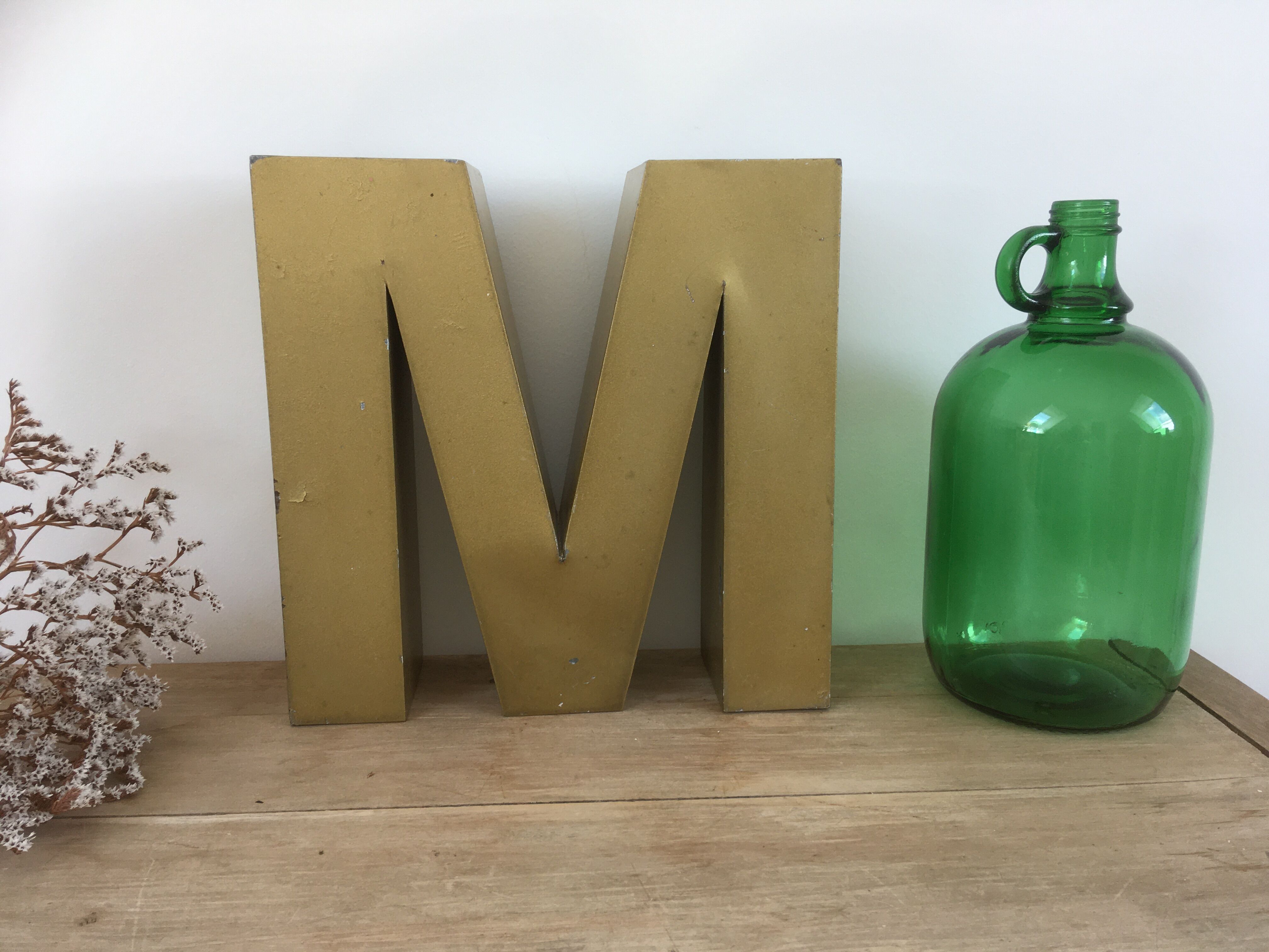 Golden vintage sign letter M
