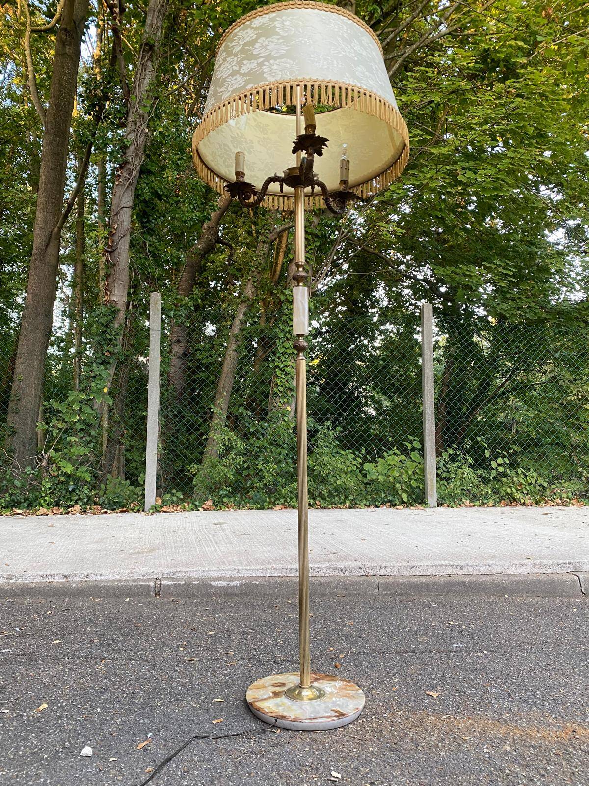 Vintage brass onyx floor lamp with fringed shade.