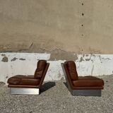 2 armchairs and 1 ottoman in brushed aluminium and brown leather, France, 1970.