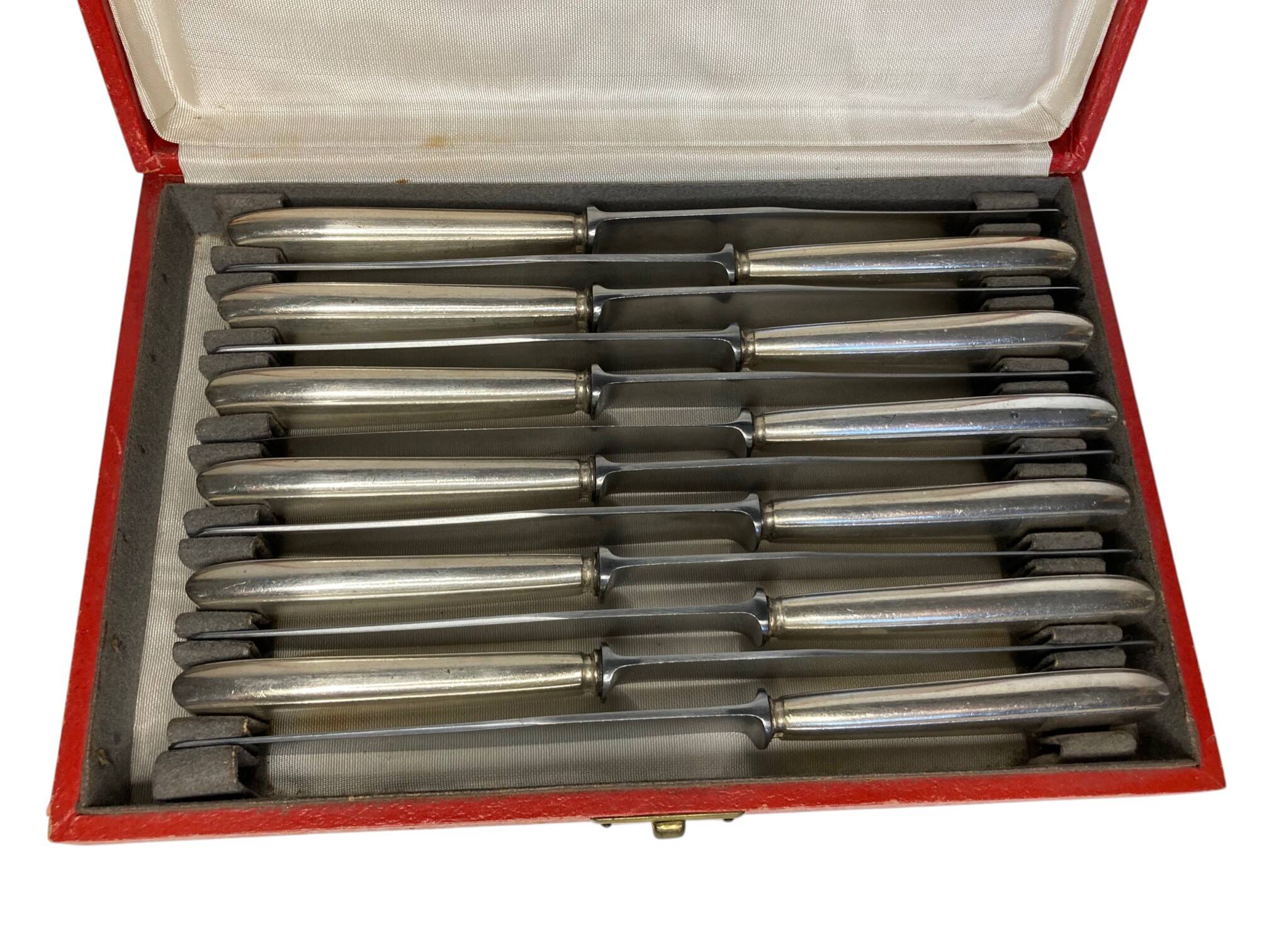 Tableware, 12 dessert knives made of silver-plated metal around 1950.