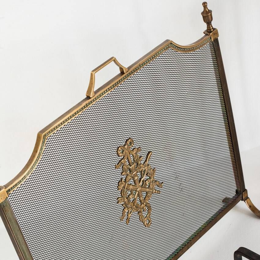 Antique bronze fire screen and fireplace accessories set. Game of seven. France, 1930s