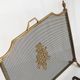 Antique bronze fire screen and fireplace accessories set. Game of seven. France, 1930s