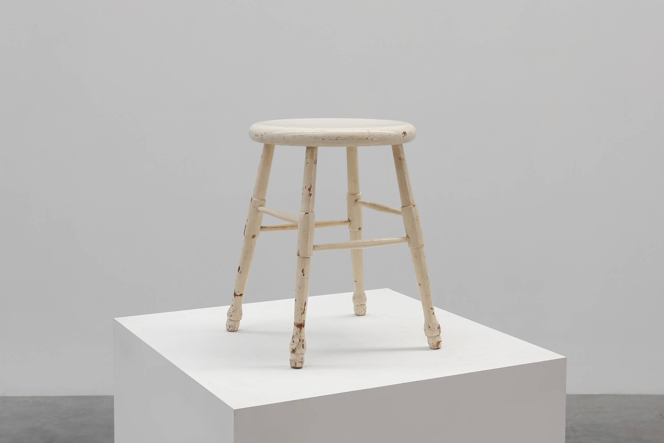 Rustic white wooden low farm stool, France ca. 1920