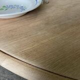 Oval table with integrated extension