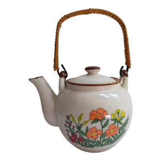 Flowered stoneware teapot with vintage rattan handle