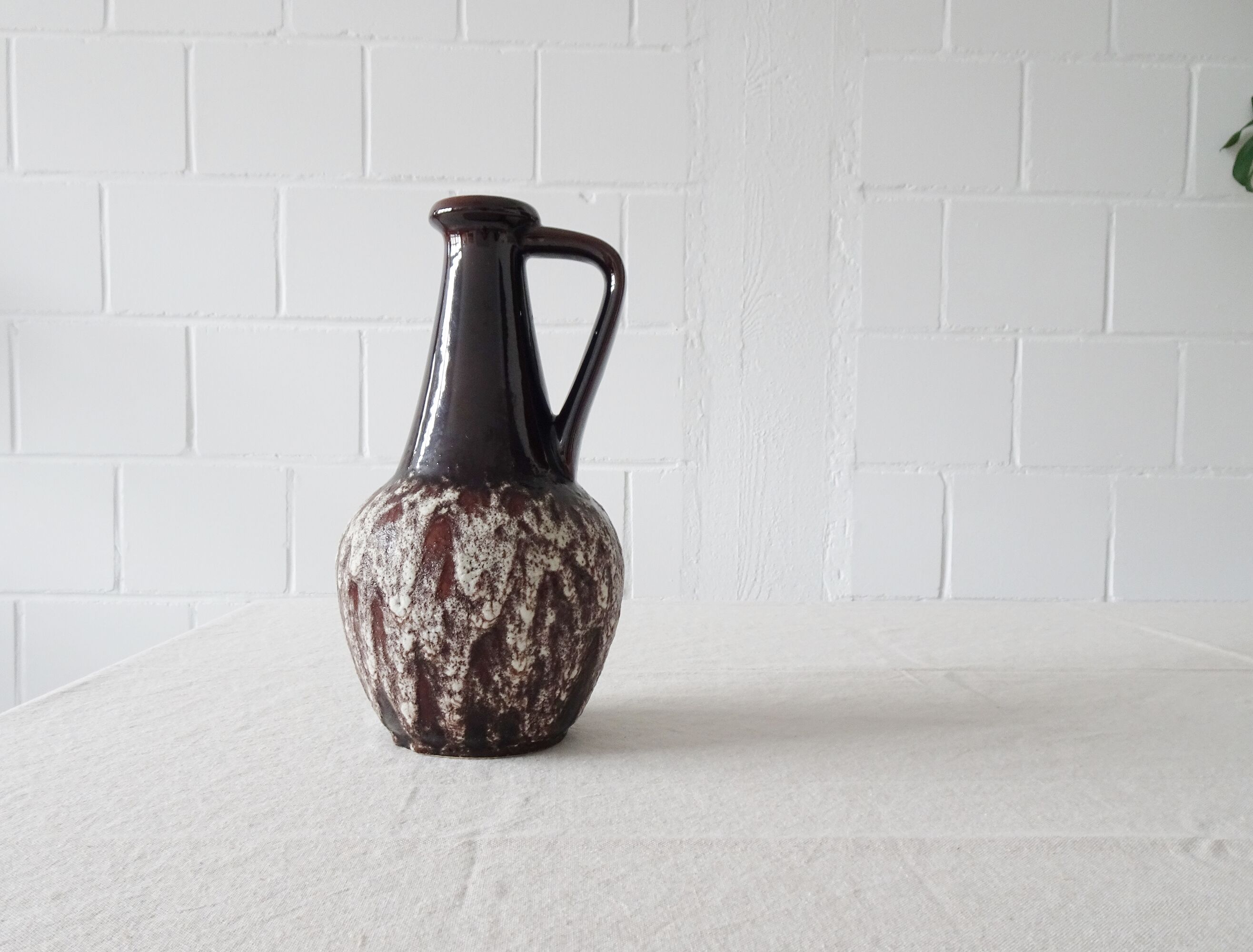 Bay ceramic pitcher with handle and fat lava glaze
