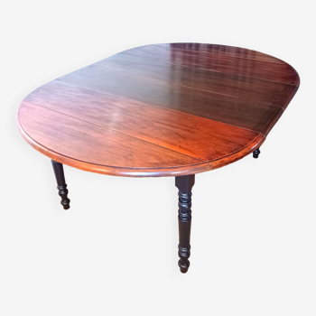 Oval table with flaps and extensions