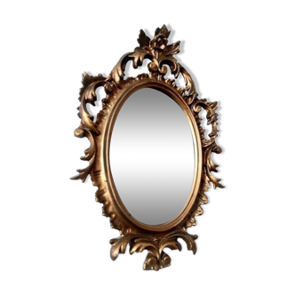 Small oval rocaille mirror in gilded wood