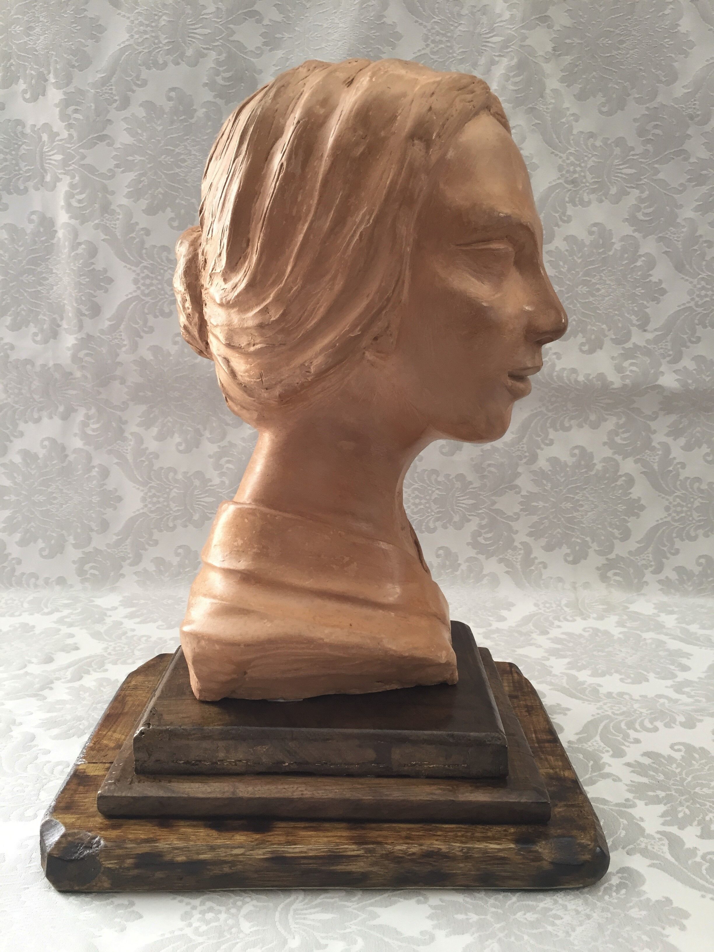 Bust in raw earth of atelier bust face of woman signed j.c.g.