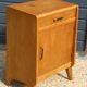 Furniture with 1 door and 1 drawer in light oak.