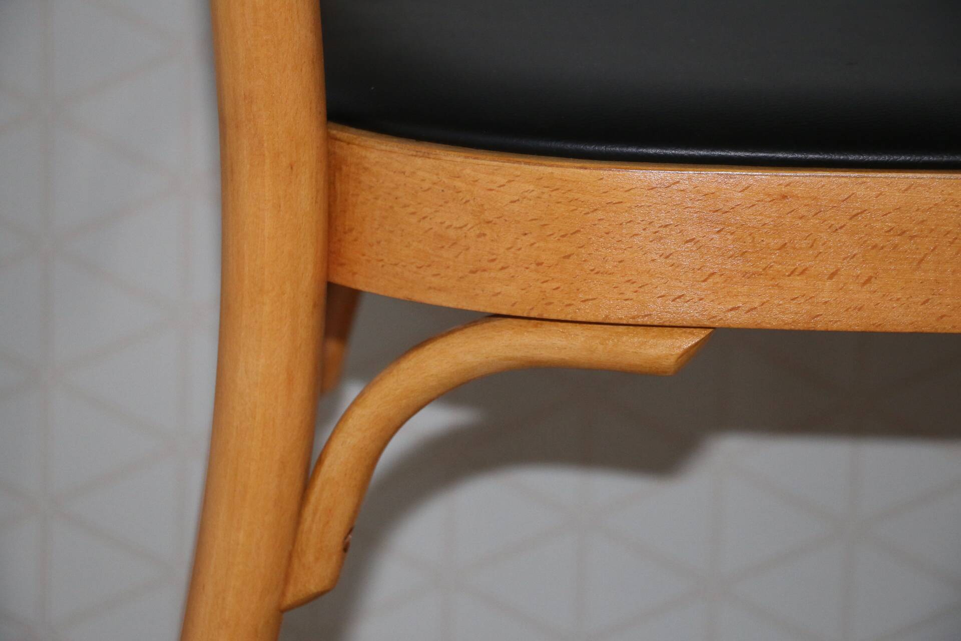 5 baumann chairs with large backs in black faux leather.