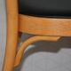 5 baumann chairs with large backs in black faux leather.