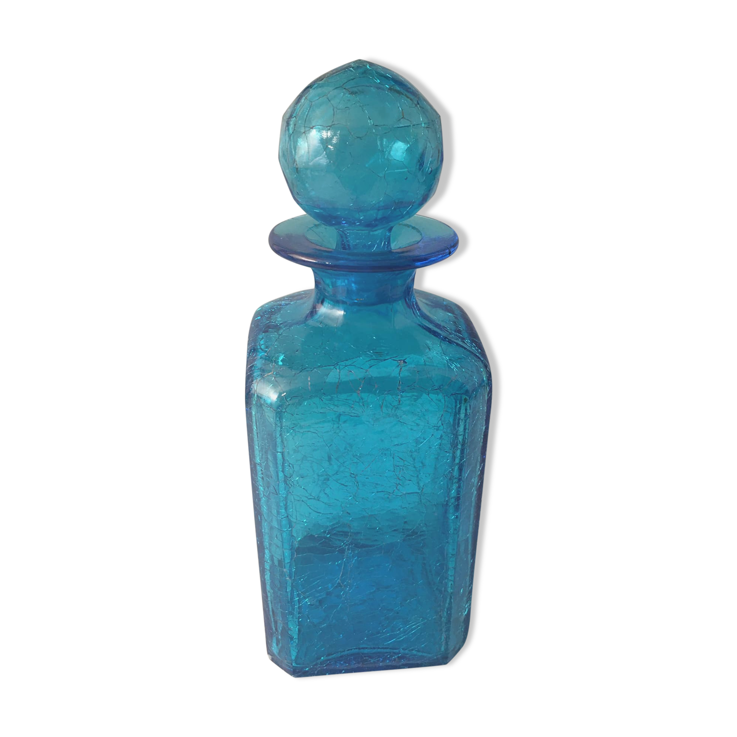 Blue glass bottle with glass cap