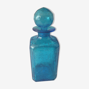 Blue glass bottle with glass cap