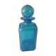 Blue glass bottle with glass cap