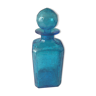 Blue glass bottle with glass cap