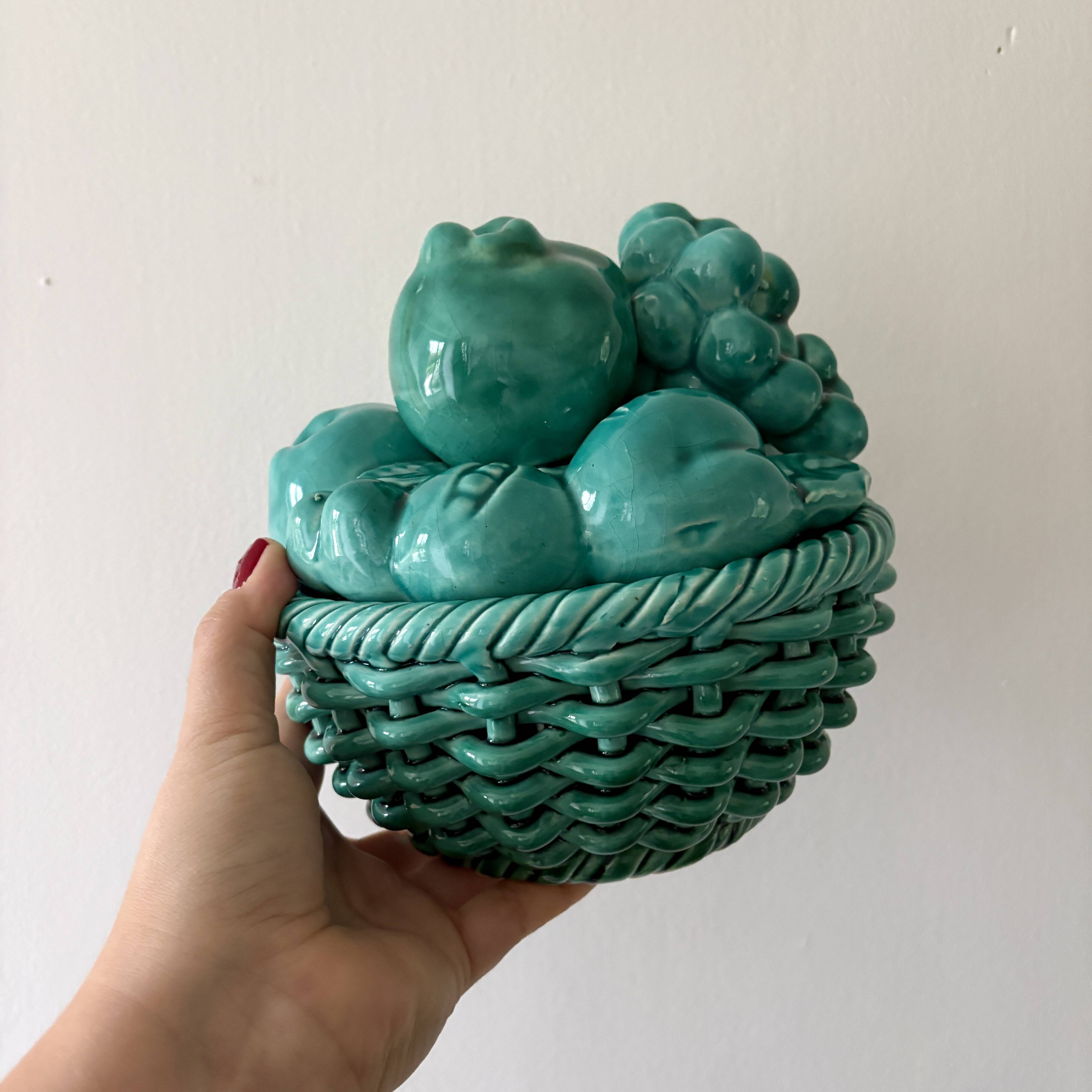 Vintage green earthenware plate/basket with fruit decorations.